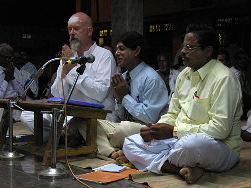 Gonga praying before beginning speech.