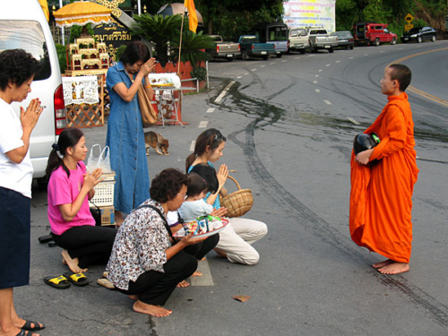 Women offering monk food in Chiang Mai