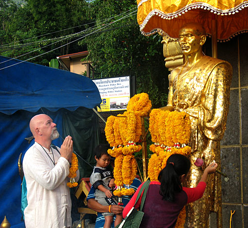 Ganga praying to Kruba Siwi Chai, the patron saint of Chiang Mai