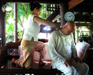 Ganga getting healing massage from Homprang Chaleeka at her Baan Hom Samunphrai Herbal Health Centre & School in Chiang Mai
