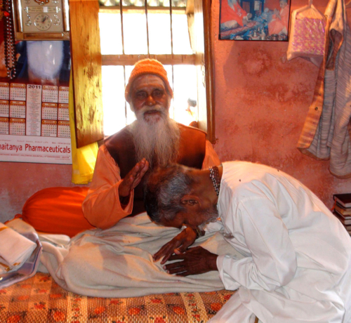 Father Varma receiving blessing of Paramananda Puri Maharaj