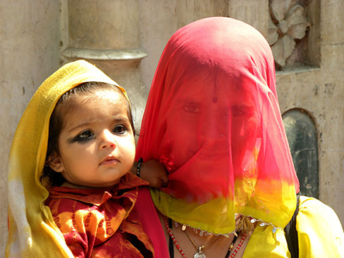 Mother veiled with her young child.