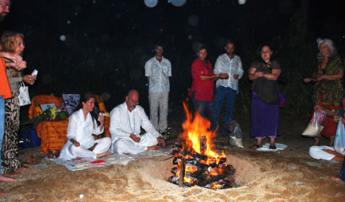 Ganga and Tara perform homa (fire puja) on the beach on Koh Samui