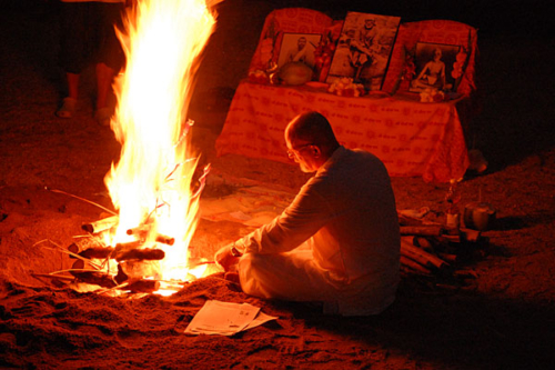 Ganga performing homa (fire puja) on the beach on Koh Samui