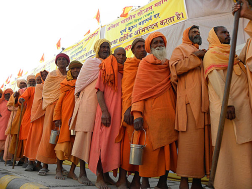 Sadhus waiting to be fed at the Kumbha Mela in Haridwar in 2010