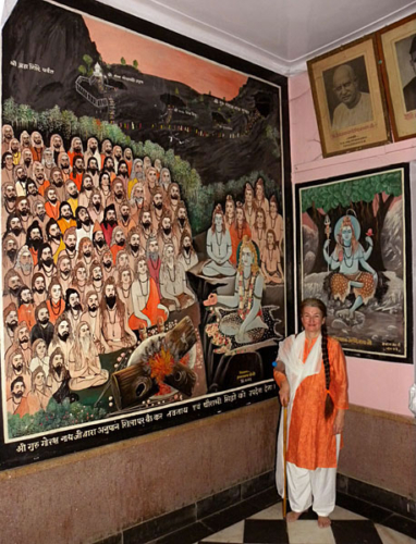 Tara next to mural in the Gorakshanath Temple in Haridwar