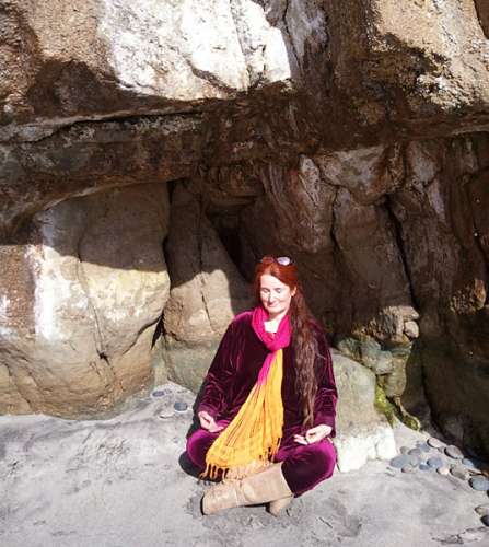 Tara meditating on the beach in Encinitas, California